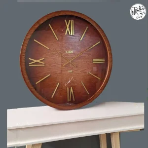 ساعت دیواری گرد پالیزی ساعت دیواری گرد پالیزی با قاب چوبی و طراحی کلاسیک